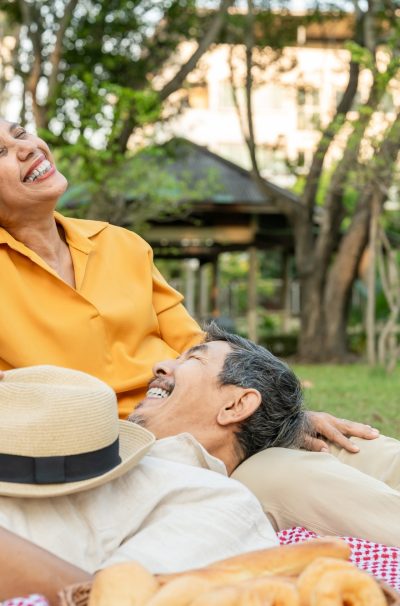 Asian senior elderly couple spend time on romantic date in the garden.